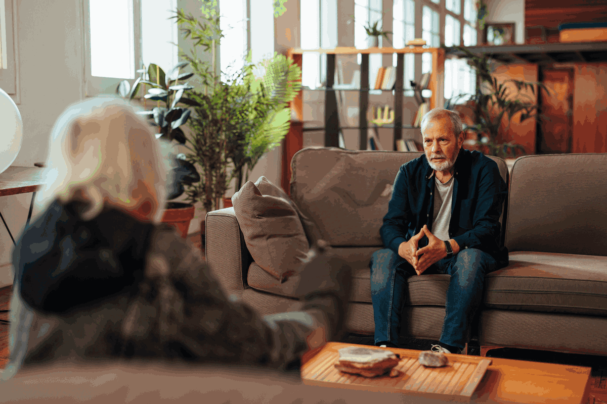 Man sitting with therapist