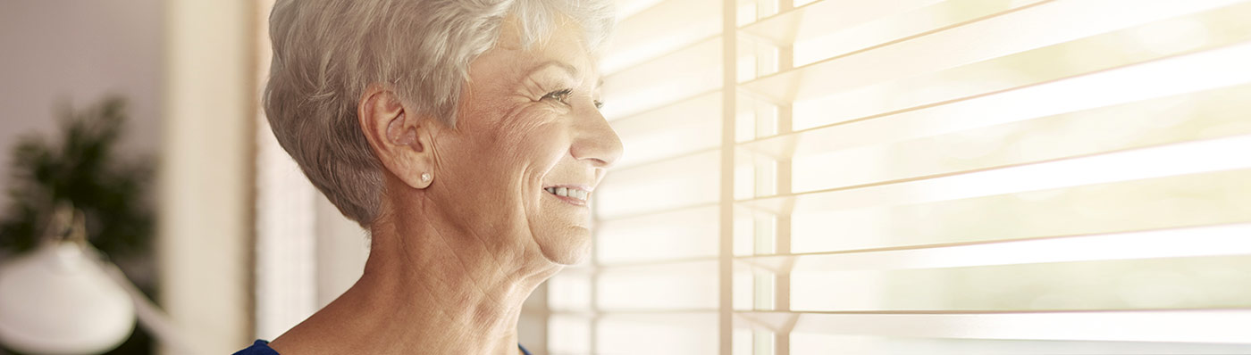 woman looking out window