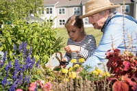 Hawthorne Ridge resident and granddaughter gardening