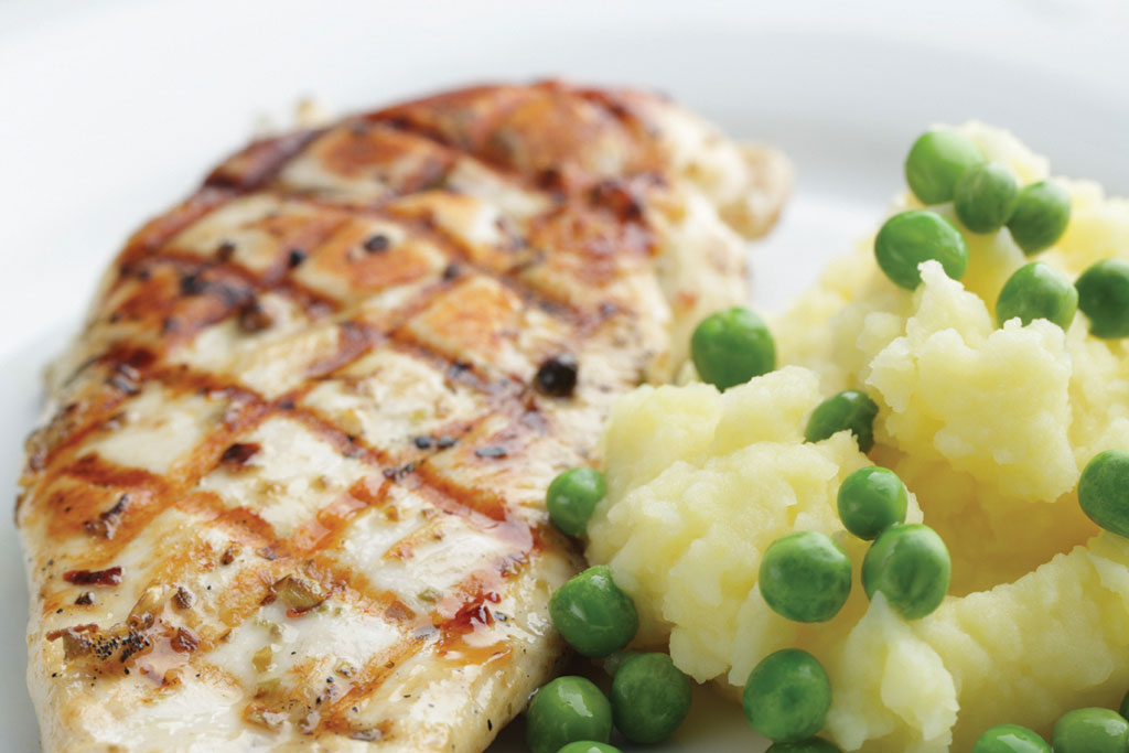 chicken, potatoes and peas meal prepared by chef