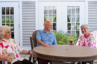 The Terrace at The Glen residents talking outdoors