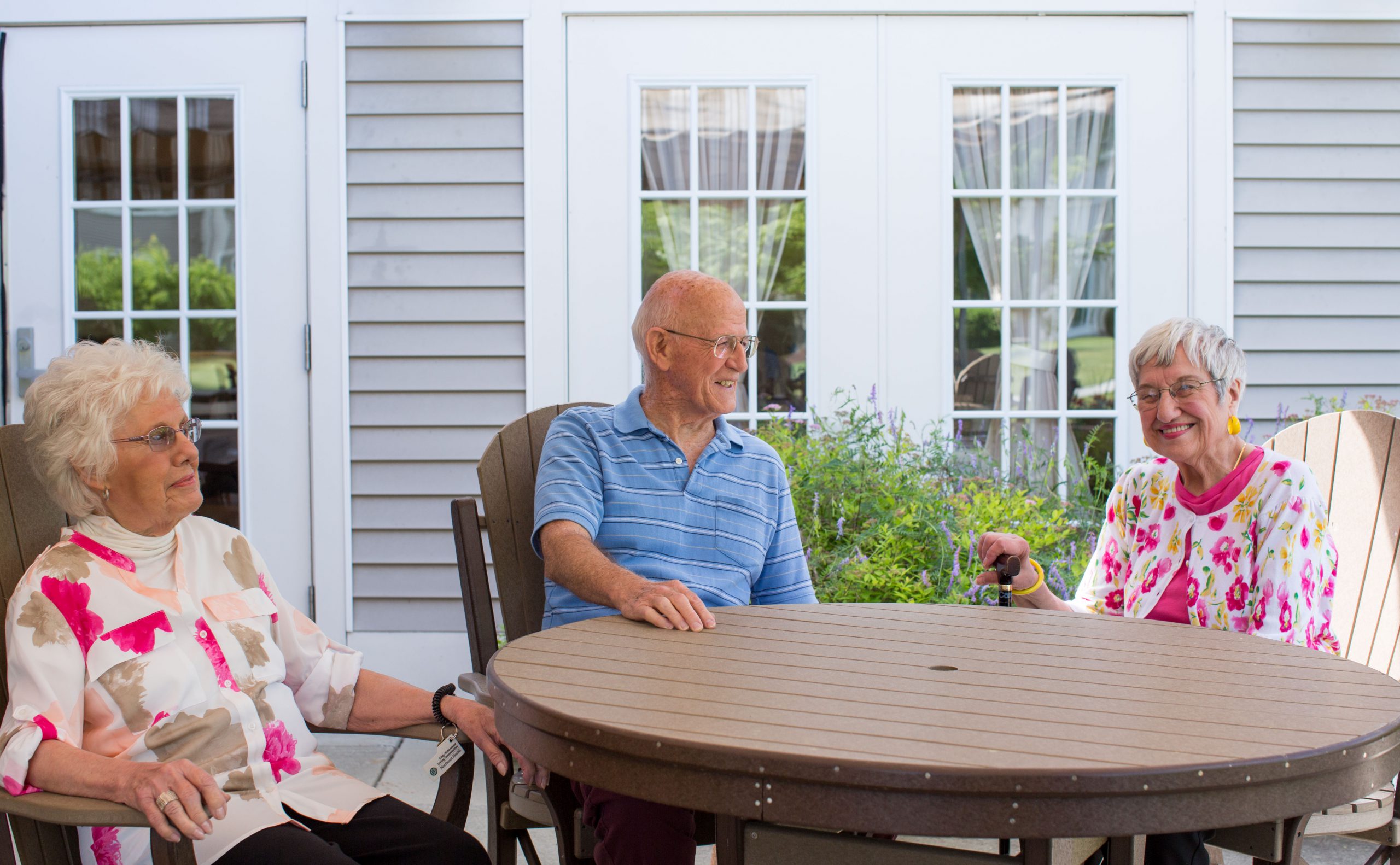 The Terrace at The Glen residents talking outdoors