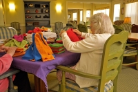 Eddy Hawthorne Ridge resident folding washcloths