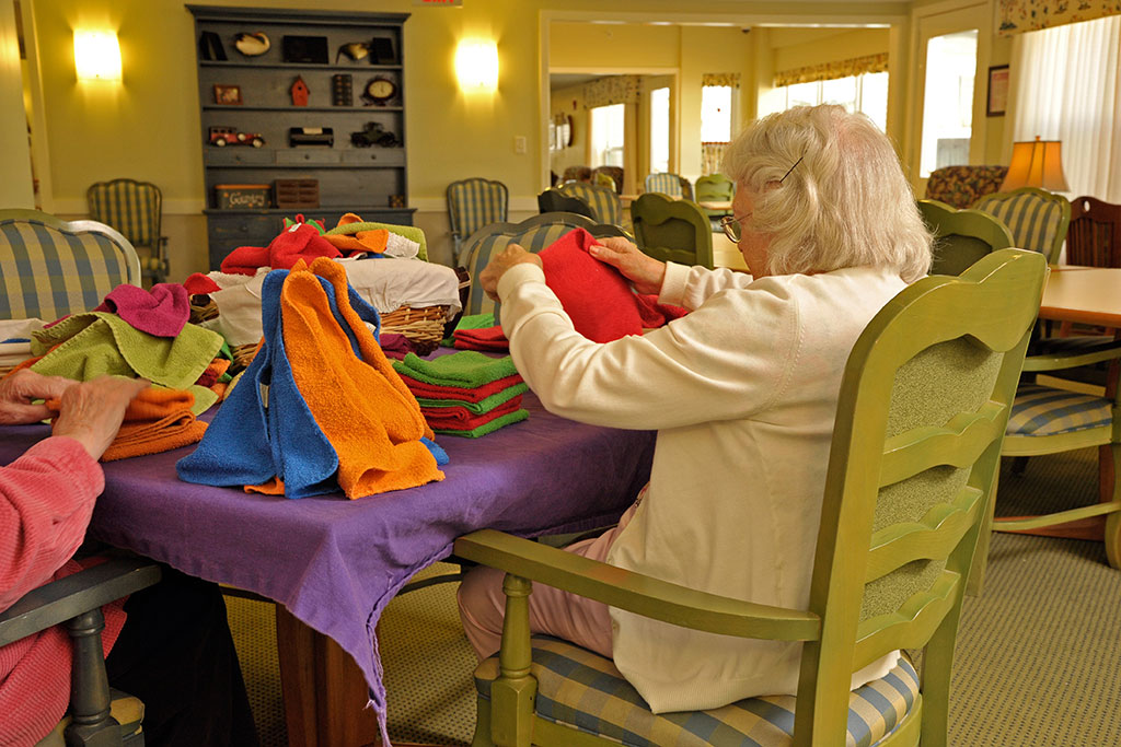 Eddy Hawthorne Ridge resident folding washcloths