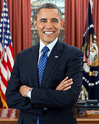 President Obama with crossed arms smiling