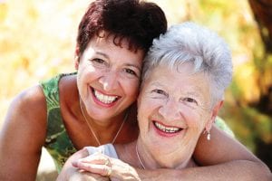 mother and daughter smiling for camera