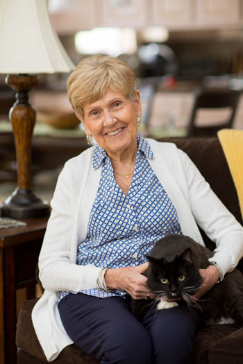 Senior with a black cat