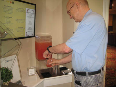 Senior staying hydrated filling a cup