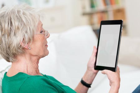 Woman holding up a device 