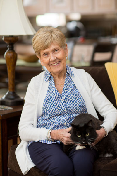 senior with cat on lap