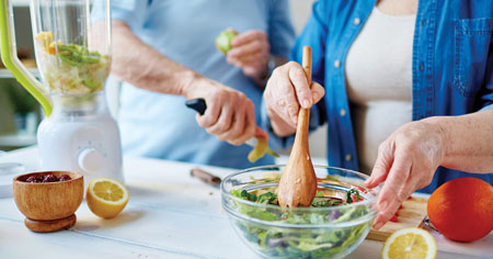 Couple making a salad