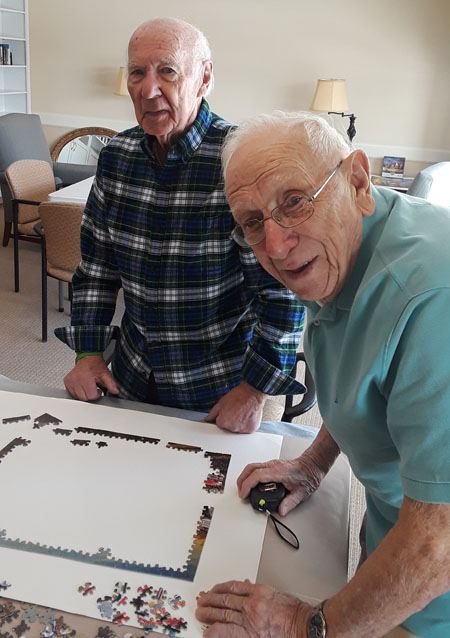 Two residents doing a puzzle