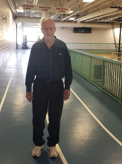 Senior man Indoors walking on the track