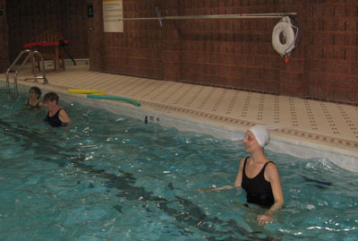 Senior exercising in pool