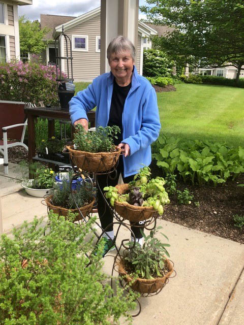 Resident Claudia gardening