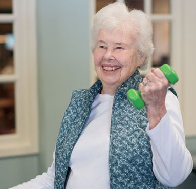Senior exercising with weights 