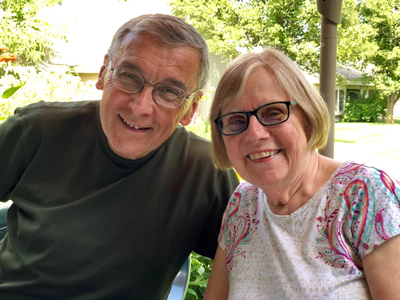 Close up photo of a happy couple on a patio