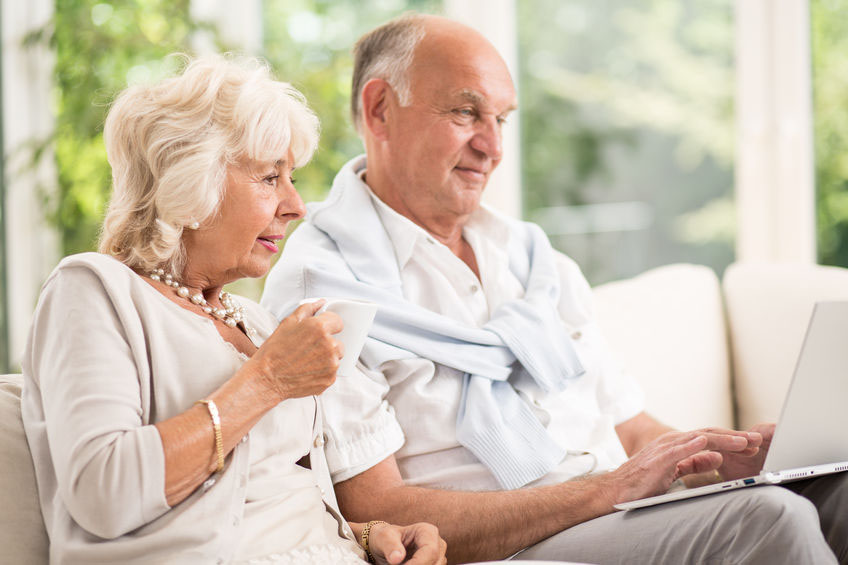 Senior couple using a laptop