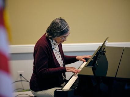 Senior woman playing piano