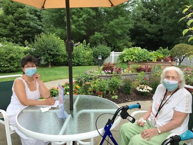 caregiver outside with mask