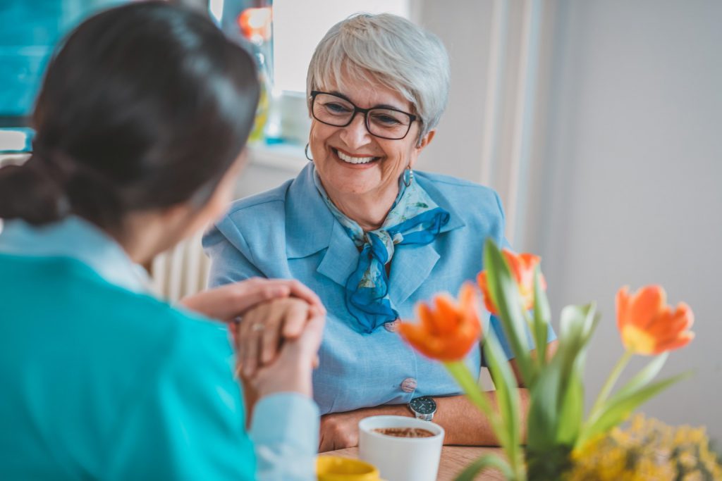 Woman with dementia speaking with a nurse