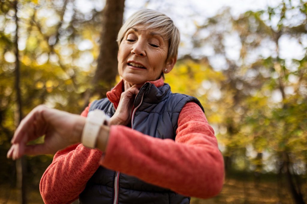 senior woman checking her pulse